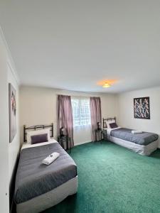 Postel nebo postele na pokoji v ubytování O'Reillys Motel