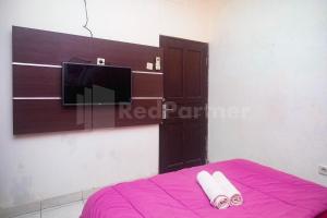 Letto o letti in una camera di Bies Malioboro Hotel RedPartner