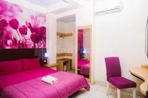 Letto o letti in una camera di Bies Malioboro Hotel RedPartner