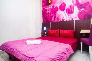 Letto o letti in una camera di Bies Malioboro Hotel RedPartner