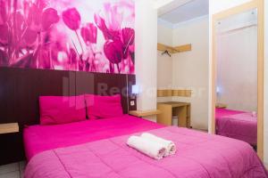 Letto o letti in una camera di Bies Malioboro Hotel RedPartner