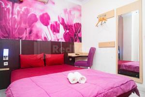 Letto o letti in una camera di Bies Malioboro Hotel RedPartner