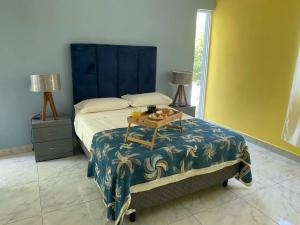 Postel nebo postele na pokoji v ubytování Casa Balam en Puerto Morelos