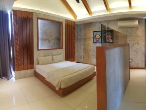 Voodi või voodid majutusasutuse Ipoh Santorini Hideaway - Hotel Inspired toas