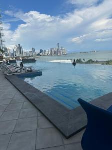 a swimming pool with a city in the background at Island Escape Properties 01 in Panama City