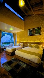 Giường trong phòng chung tại Harness Zipline And Adventure Resort