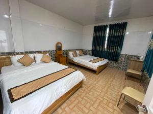 Ένα ή περισσότερα κρεβάτια σε δωμάτιο στο Thien Son Homestay - Giáp Biển