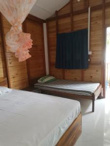 Postel nebo postele na pokoji v ubytování Bashi eco beach cabana