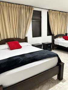 Postel nebo postele na pokoji v ubytování Hotel Plaza Real Pereira + 28 fotografií