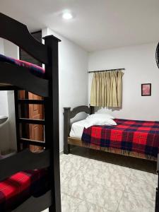 Letto o letti in una camera di Hotel Plaza Real Pereira