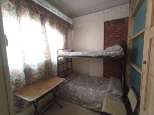 Un pat sau paturi într-o cameră la david hostel