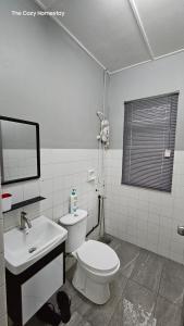 Ванная комната в The Cozy Homestay @ Tabuan Jaya