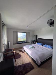 Postel nebo postele na pokoji v ubytování AmanTa by Aman Homestay