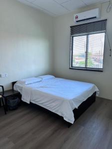 En eller flere senge i et værelse på Steve & Mick Guesthouse