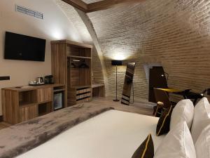 Postel nebo postele na pokoji v ubytování Hotel Maria Cristina + 37 fotografií