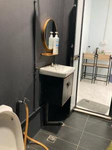 a bathroom with a sink and a mirror at Roomstay McAyoh Self Check In Concept in Setiu +16 photos