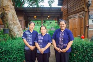 a group of women standing in front of a building at Pastela Doi Saket Villa & Spa in Ban Pong +77 photos