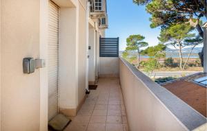 a corridor of a building with a walkway at Awesome Apartment In Hyères With Wifi in Hyères