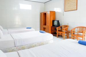 Postel nebo postele na pokoji v ubytování Segara Hotel & Restaurant