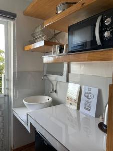 Kuchyň nebo kuchyňský kout v ubytování Italy Condotel Darasa