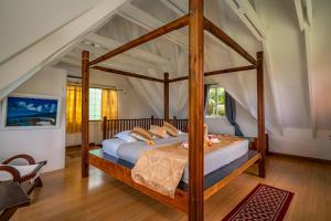 Postel nebo postele na pokoji v ubytování Lemongrass Lodge