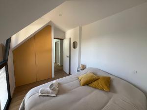 Postel nebo postele na pokoji v ubytování Villa Larmor-baden