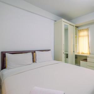 Ένα ή περισσότερα κρεβάτια σε δωμάτιο στο Homey Studio Apartment at Dramaga Tower near IPB By Travelio