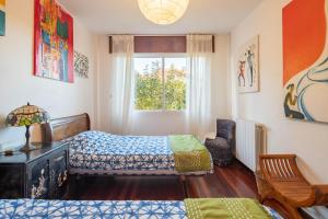 Postel nebo postele na pokoji v ubytování O Axouxere