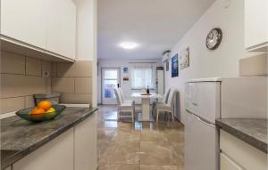 Kuchyň nebo kuchyňský kout v ubytování Apartment Premantura Iii