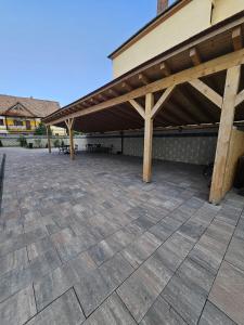 a patio with awning on top of a building at Casa Raduly - Apartament Demisol in Sibiu +38 photos