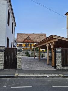 a building with a pavilion in the middle of a street at Casa Raduly - Apartament Demisol in Sibiu