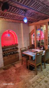 a dining room with a table and a pizza oven at Hatay Hotel in Istanbul