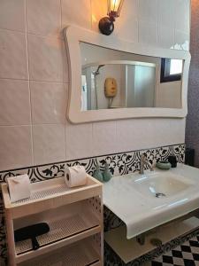 a bathroom with a sink and a mirror at Happy Villa in Choengtalay in Laguna Phuket