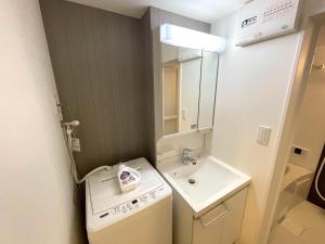 Ένα μπάνιο στο Guesthouse Albatross Self Check-in Hakata