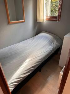 Ένα ή περισσότερα κρεβάτια σε δωμάτιο στο Het Vijverhuisje +5 φωτογραφίες