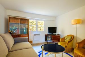 Un televizor și/sau centru de divertisment la Propriété Muraccioli 1 - Maison avec vue mer