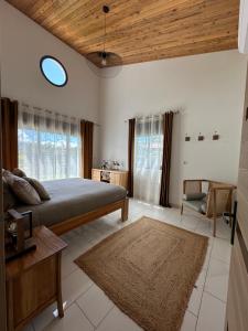 Postel nebo postele na pokoji v ubytování Les lodges de Salazie