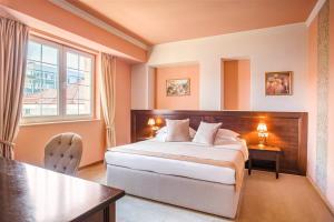 Postel nebo postele na pokoji v ubytování Simfonia Boutique Hotel