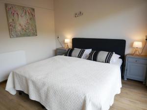 Postel nebo postele na pokoji v ubytování Wijde Blick Callantsoog