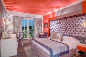 Postel nebo postele na pokoji v ubytování Simfonia Boutique Hotel