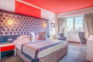 Postel nebo postele na pokoji v ubytování Simfonia Boutique Hotel
