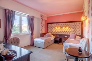 Postel nebo postele na pokoji v ubytování Simfonia Boutique Hotel