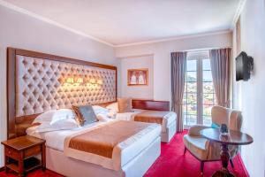 Postel nebo postele na pokoji v ubytování Simfonia Boutique Hotel