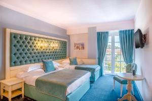 Postel nebo postele na pokoji v ubytování Simfonia Boutique Hotel