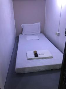 Postel nebo postele na pokoji v ubytování RDC - Mariveles Transient Capsule