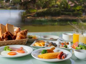 a table topped with plates of food and drinks at Hotel New Otani Saga in Saga