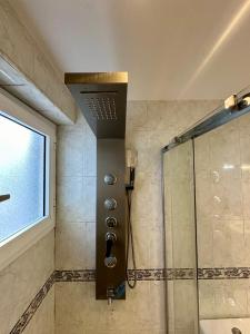 a bathroom with a shower with a glass door at Very best flat ust 800m Postiguet-Beach in Alicante +37 photos