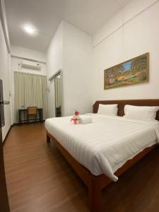 Postel nebo postele na pokoji v ubytování Ong Hotel