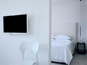 Voodi või voodid majutusasutuse Acteon Hotel toas