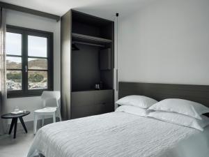 Voodi või voodid majutusasutuse Acteon Hotel toas
